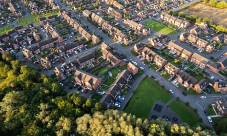Top down aerial view of houses and streets in a residential area