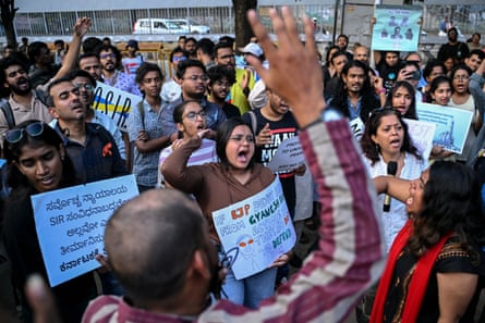 Protesters chanting and holding placards