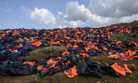 Thousands of life jackets from refugees and migrants form a small hill on the island of Lesbos, Greece