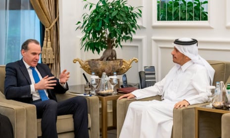 A handout picture released by the official Qatari news agency (QNA) shows Qatari foreign minister Mohammed bin Abdulrahman bin Jassim al-Thani (R) meeting with US National Security Council coordinator for the Middle East and North Africa Brett McGurk in Doha on 19 November 2023