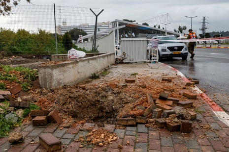 An impact crater left by a rocket fired from southern Lebanon that landed near the entrance of Ziv hospital in Israel's northern city of Safed on Wednesday.