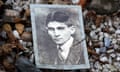 Photo of Franz Kafka on his grave at the New Jewish Cemetery, Prague.