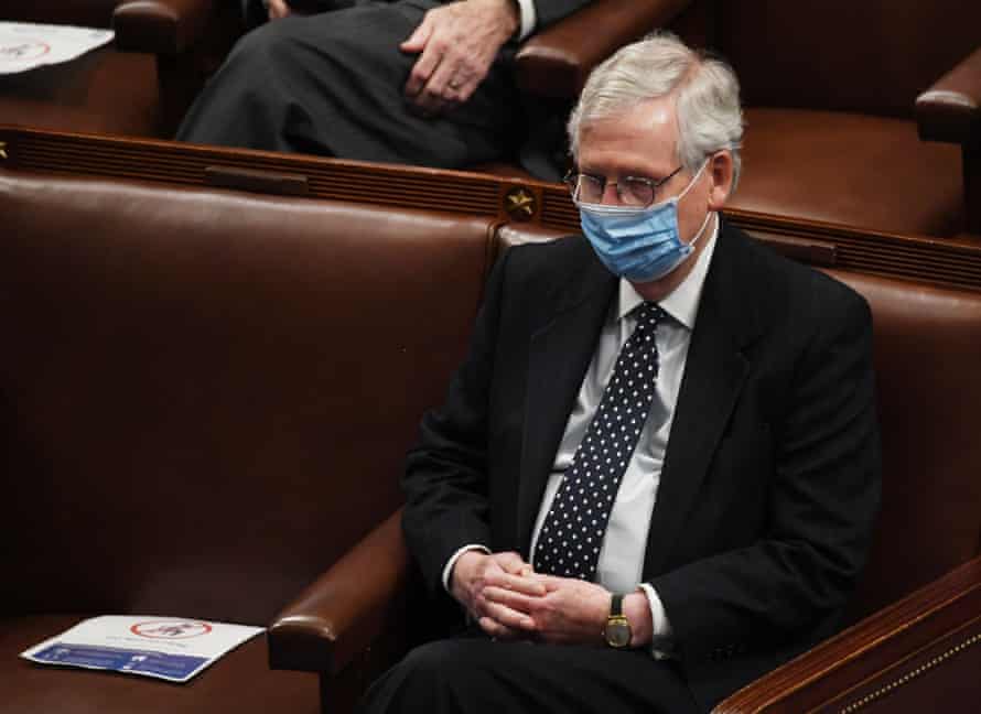Senate Majority Leader Mitch McConnell sits in the House Chamber hours after Trump supporters stormed the Capitol to halt Congress from ratifying the election results.