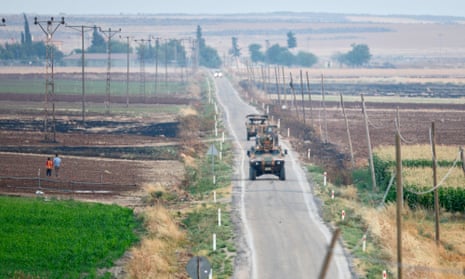Turkish soldiers patrol the Syrian border