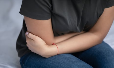 Woman holding her stomach