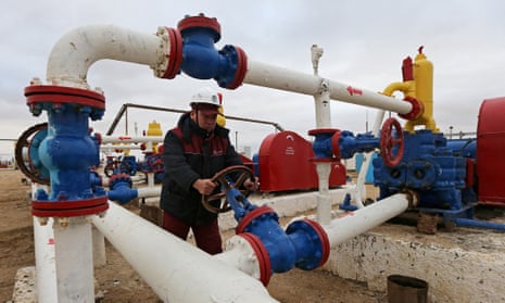 A worker checks the pressure of pumps at an oil-pumping station in the Uzen oil and gas field in the Mangistau Region, Kazakhstan.