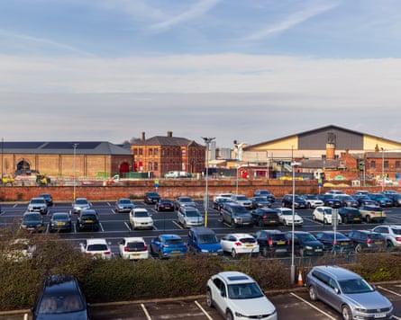 View of a car park with many stationary vehicles