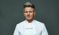 Close up of Gordon Ramsey wearing a white chef uniform in front of a dark grey background