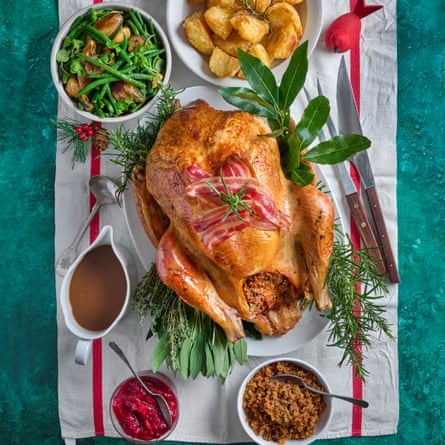 Buttermilk-brined roast turkey with wild rice, chestnut and apple stuffing, cranberry and red pepper sauce, roast potataoes and gravy.
