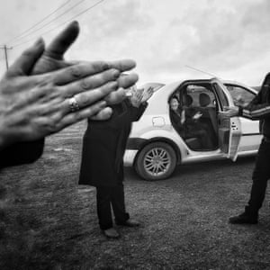 Akbar Mehrinezhad - 1st Place Winner, Single image: Nowruz Clapping ‘My friend’s family was celebrating Nowruz [the Iranian new year] on the side of the road. The grandfather opened the car door and started clapping. He was suffering from Alzheimer’s and has since passed away’
