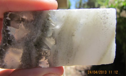 Deep below the Dead Sea bed, drilling revealed thick layers of salt, caused by past warm, dry periods. In this specimen, transparent crystals (left) formed on what was then the bottom during winter; finer white ones (right) formed on the water surface in summer and later sank.