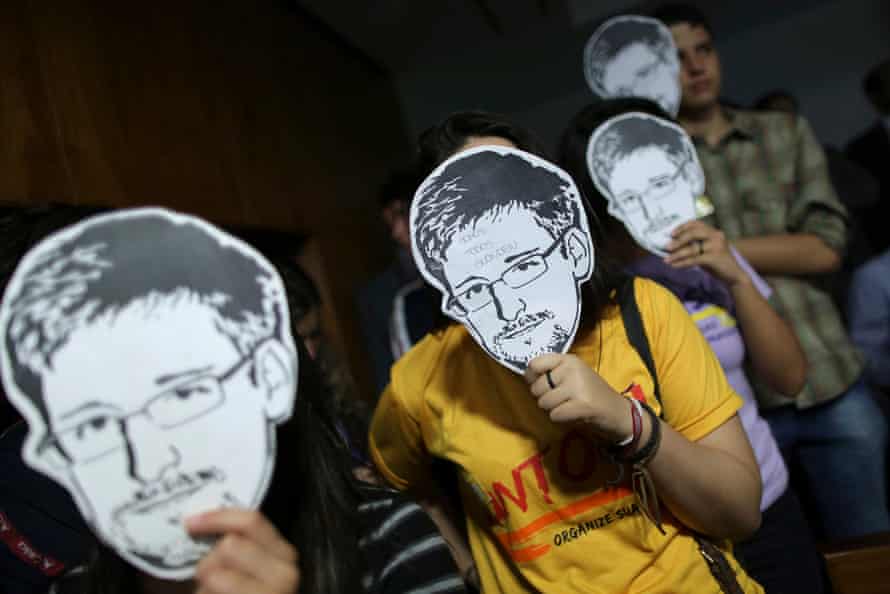 Activists in Brazil wore Snowden masks to express their opposition to NSA spying programs in 2013.
