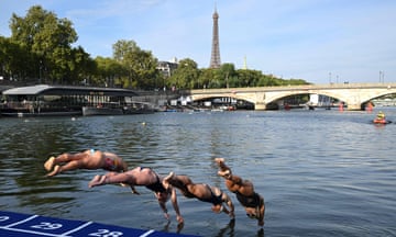 Four people diving into river with Eiffell Tower in the background