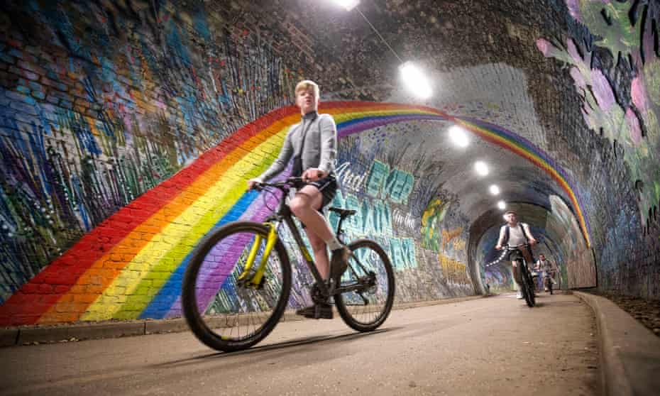 Cyclists pass underneath the rainbow mural in Colinton tunnel, Edinburgh, as the UK continues in lockdown.