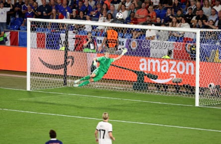 Ann-Katrin Berger launches herself backwards to claw away a deflected effort.