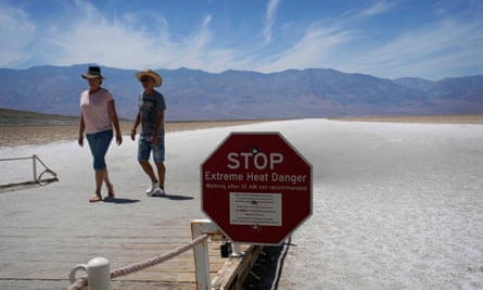Sign warns visitors of extreme heat danger at Badwater Basin, in Death Valley national park, California.