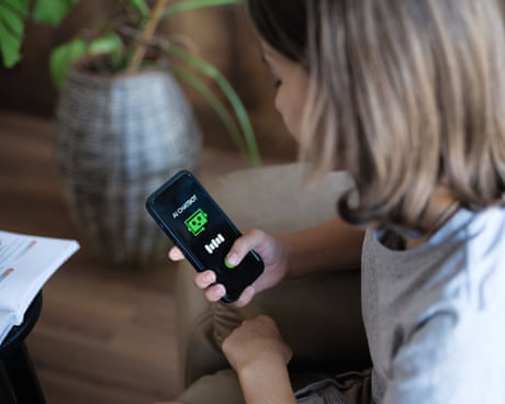A girl holding a mobile phone with an AI chatbot on the screen