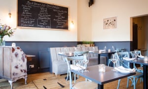 The cream and light blue interior of the Aizle restaurant, Edinburgh, Scotland.