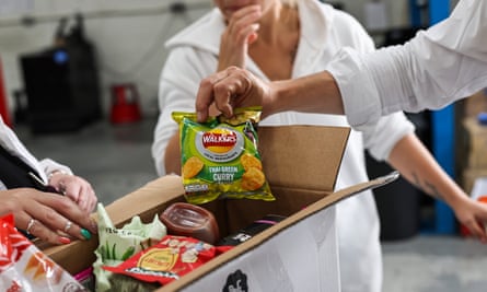 Customers at Rogers Wholesale Foods depot in Bilston, Wolverhampton, which sells food and drink past the best-before date at discount prices