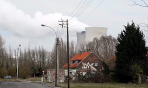 Steam rises from the cooling towers of the Doel nuclear power plant.