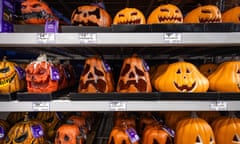 rows of plastic pumpkins on a shelf