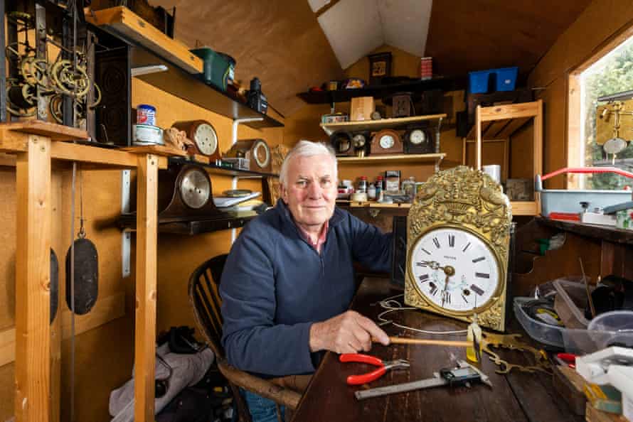 Mason at home with one of his old clocks.