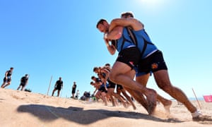 Matt Jess carries Phil Dollman up a sand dune