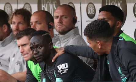 Roberto Firmino places a hand on the shoulder of an unhappy Sadio Mané after their substitutions at Burnley in August 2019.