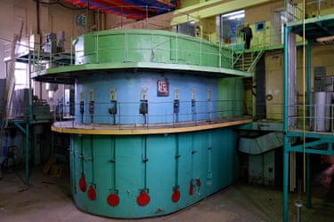 A large three-tier structure in faded blues and greens