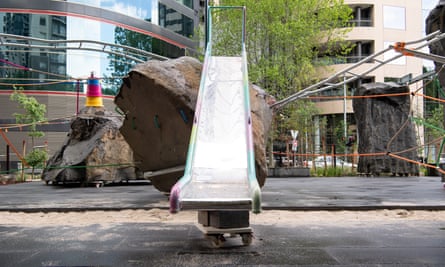 A slide, propped up on bricks and wheels.