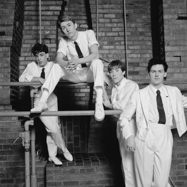 Mark Hollis, second from left, with, from left, the keyboard player Simon Brenner, drummer Lee Harris and bassist Paul Webb, in a 1982 publicity shot for Talk Talk - Hollis was said to hate the way EMI packaged the band in white suits and black ties.