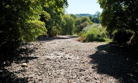 The desiccated bed of the River Mole by Pressforward Bridge, Surrey, as dry weather and hot temperatures continue.