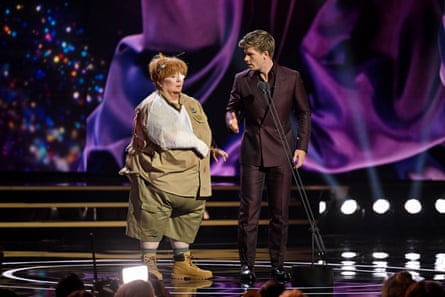 Magda Szubanski in character as her Kath & Kim role Sharon Strzelecki with Robert Irwin onstage.