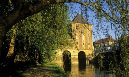Ancient water mill over the Meuse River housing the Rimbaud Museum, France