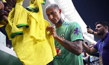 Richarlison signs shirts for fans before Brazil’s World Cup qualifier against Bolivia in Belem.