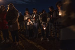 People gather for a candlelight vigil in Chesapeake, Virginia, US, for six people killed at a Walmart store when a manager opened fire with a handgun