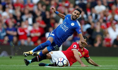 Leicester City’s Riyad Mahrez is fouled by Manchester United’s Henrikh Mkhitaryan.