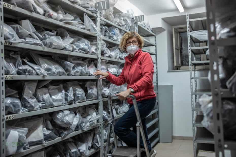 Rosanna Corsaro in the ‘petroteca’, a room storing old volcanic rock samples from Etna at the volcanology institute.