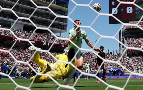 Qatar's Mahmoud Abunada fouls Switzerland's Remo Freuler to concede a penalty.