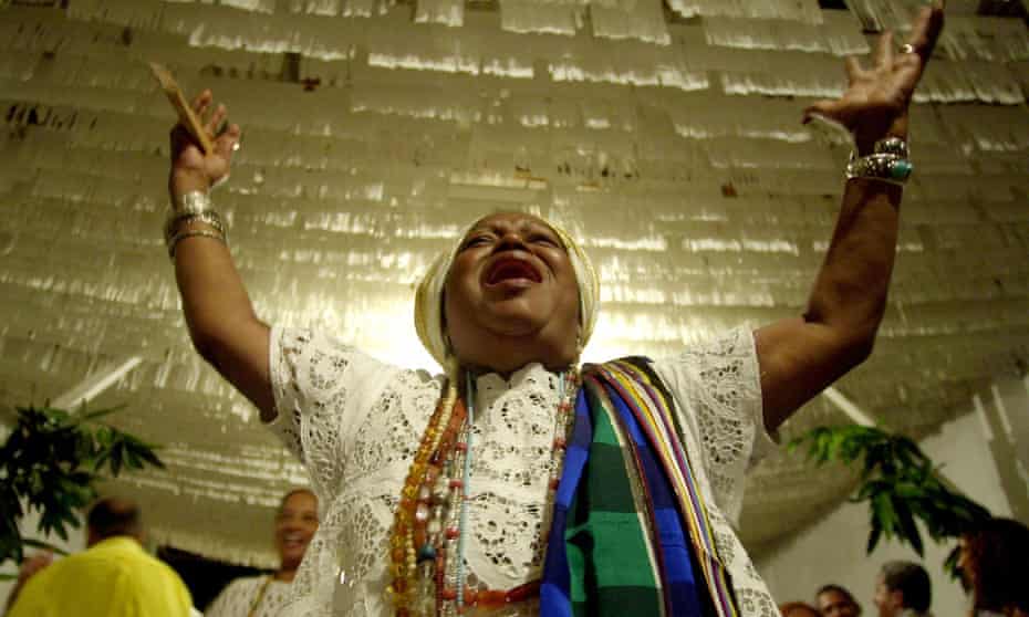 Candomble priestess Mae Beata de Iemenja invokes Ossae, the Yoruban god of medicine and herbs, during a Candomble ceremony in Nova Iguacu, Brazil.