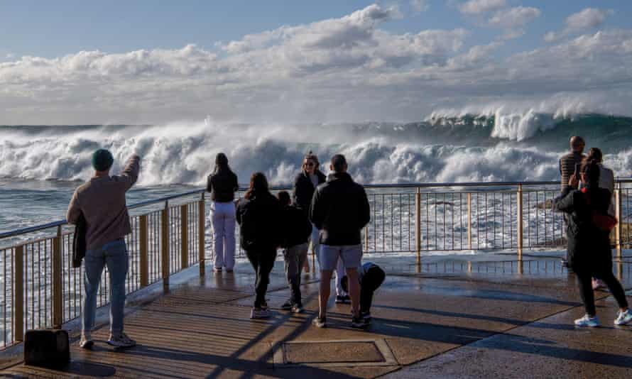 People photographing large waves at Bronte Beach