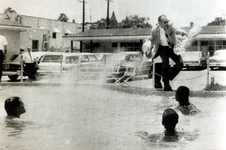 Motel manager James Brock dumps acid into a ‘whites only’ pool in Florida in 1964 after black and white demonstrators jumped in.