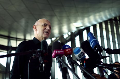 President of the German Football Association Bernd Neuendorf speaks to the media at the airport in Doha after Germany were eliminated from the World Cup.