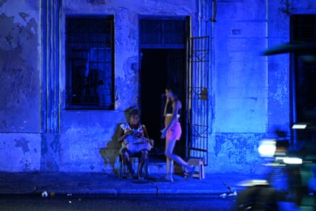 A woman checks a cell phone during a blackout in the Centro Habana neighbourhood in Havana.