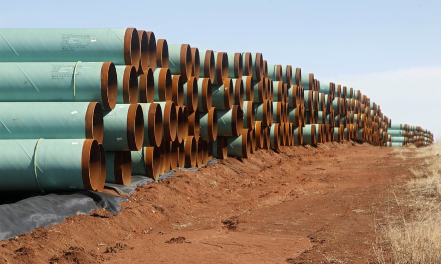 Miles of pipe ready to become part of the Keystone Pipeline are stacked in a field near Ripley, Okla. (AP Photo/Sue Ogrocki, File)