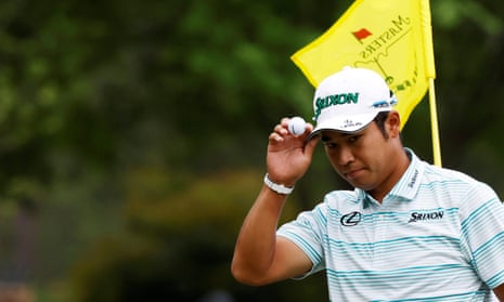Hideki Matsuyama acknowledges the crowd after holing an eagle putt on the 15th green.