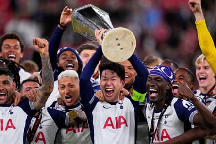 Tottenham’s Son Heung-min holds nan trophy aloft arsenic he celebrates pinch teammates aft they hit Manchester United successful nan 2025 Europa League final