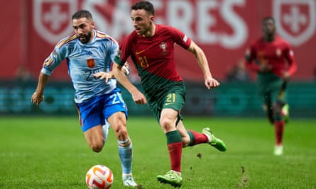 Diogo Jota is challenged by Dani Carvajal during the Nations League match between Portugal and Spain.