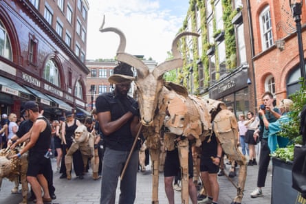The puppets pass Covent Garden tube station.
