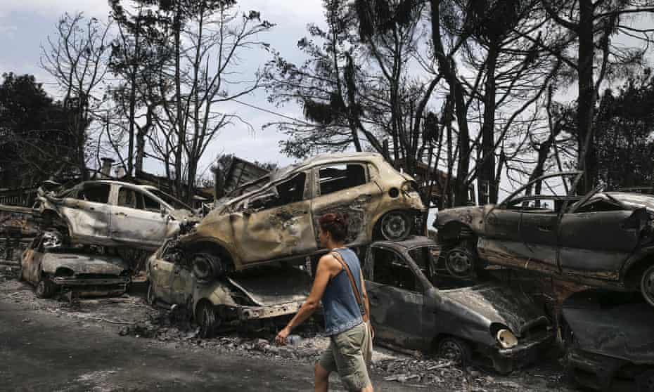 A stack of burnt cars piled up in Mati, the village worst hit by deadly wildfires in Greece